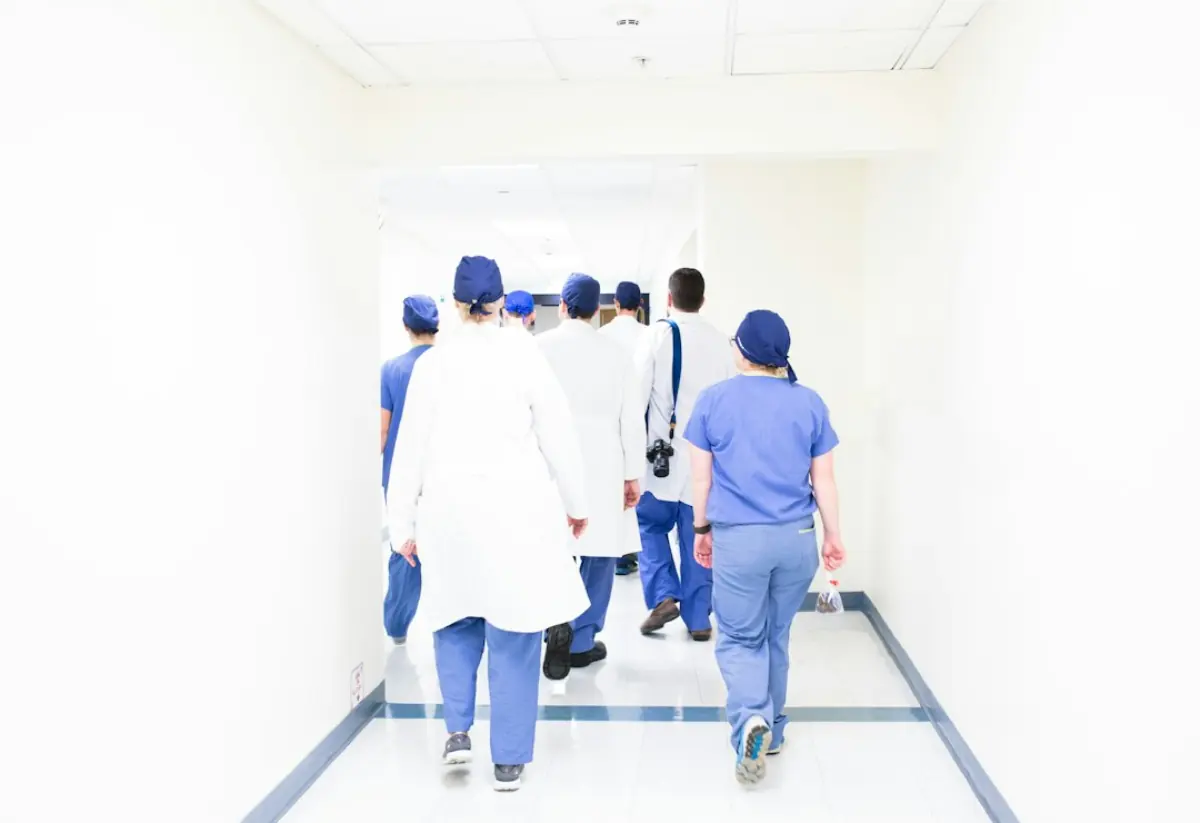 Medical staff walking along a hospital corridor
