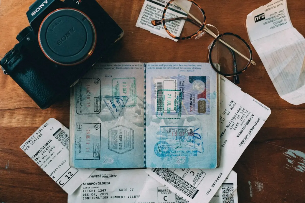 Passport with visa stamps on a desk, travel visa planning